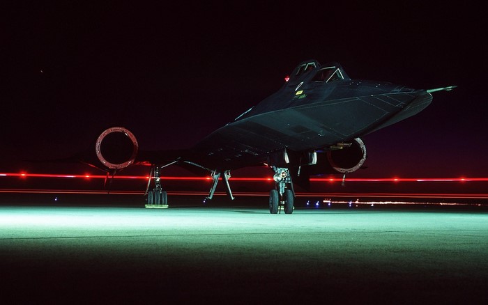 Lockheed SR-71 Blackbird aircraft on tarmac at night