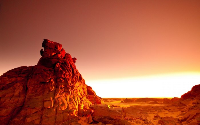 Desert rock formation at sunset