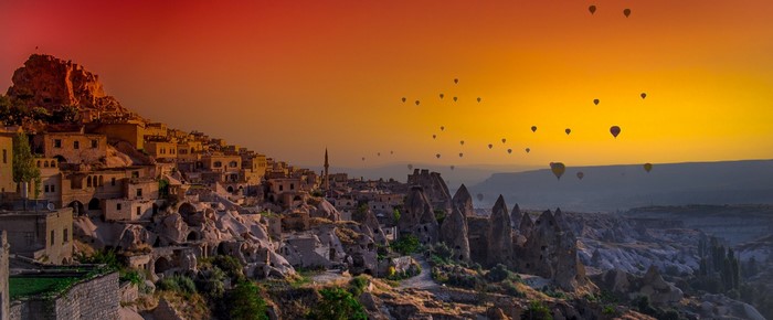 Hot air balloons over Cappadocia at sunset