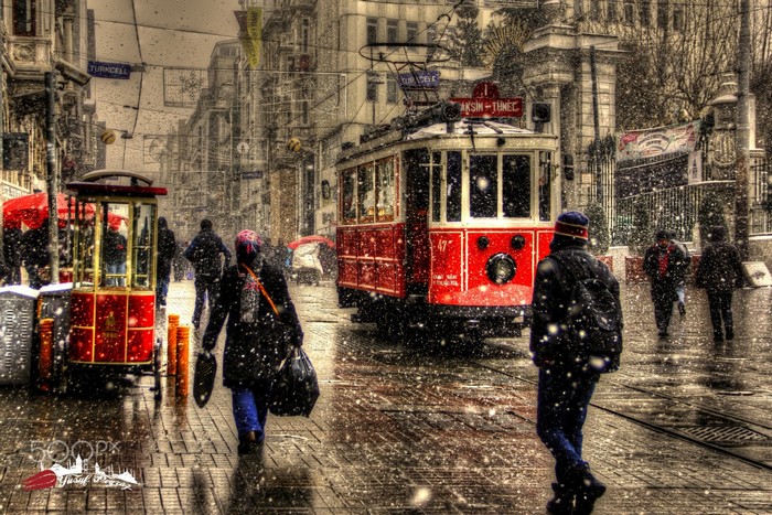 Red tram on a snowy street in Istanbul, Turkey