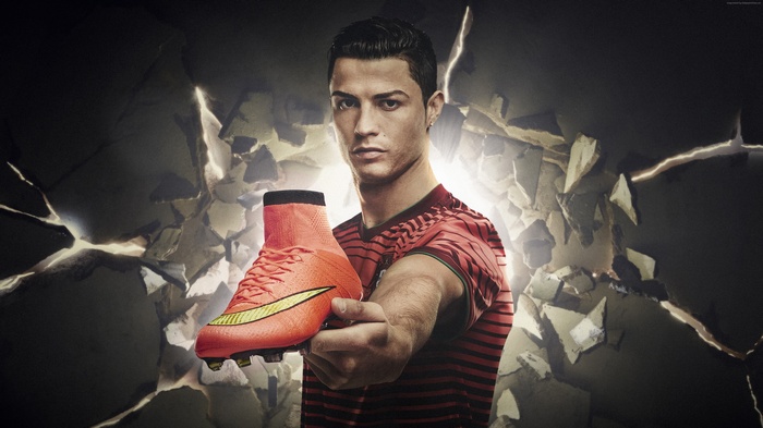 Cristiano Ronaldo holding Nike Mercurial soccer boot