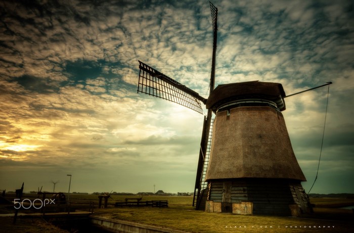 Windmill at sunset with dramatic clouds