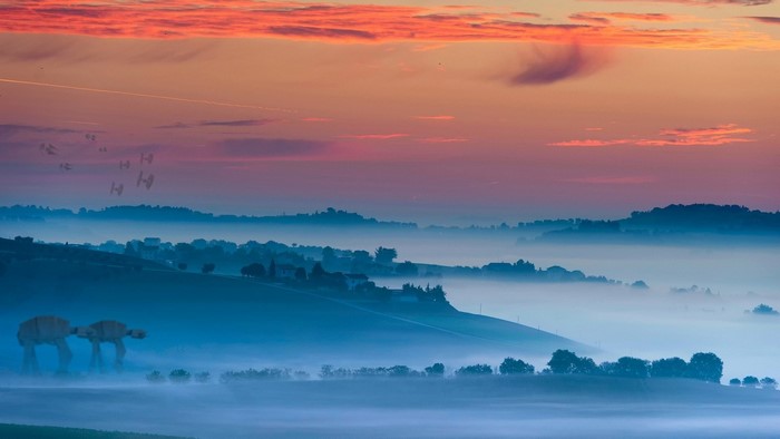Star Wars AT-ATs and TIE Fighters over misty landscape at sunset