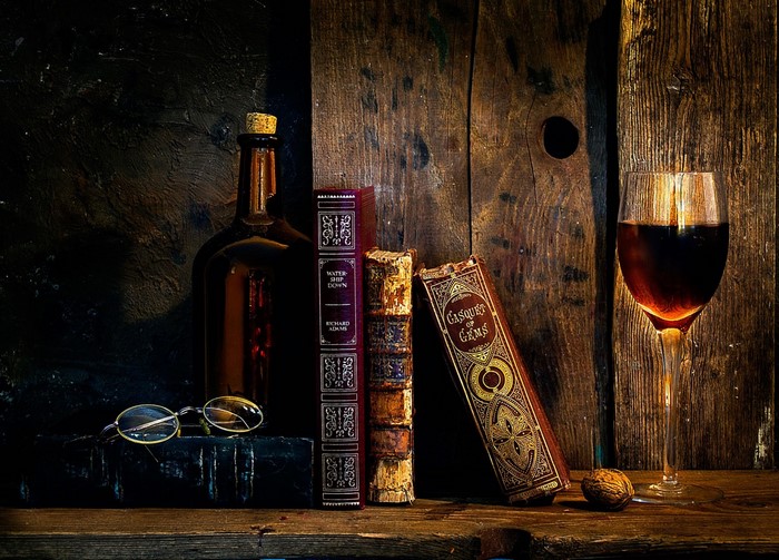 Still life with books, wine, and glasses