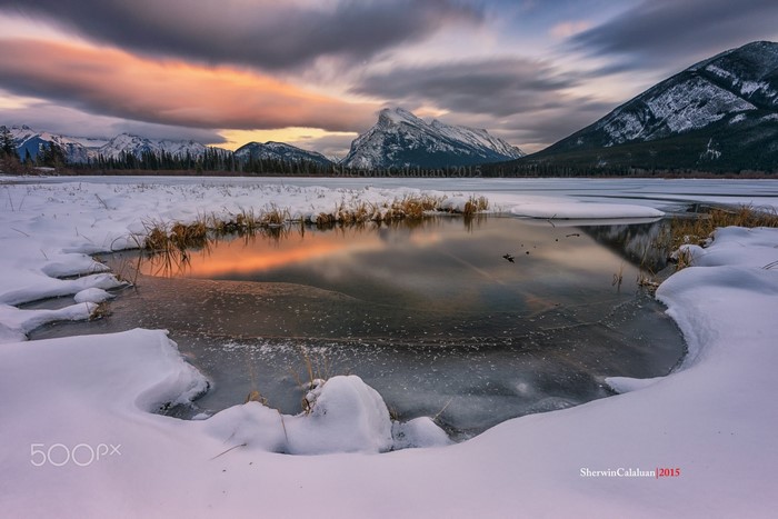 Sunrise Over Snowy Mountain Lake with Reflection
