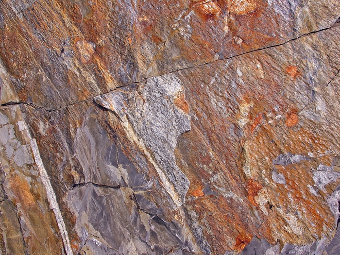 Stone texture with cracks and brown and gray patterns 4K