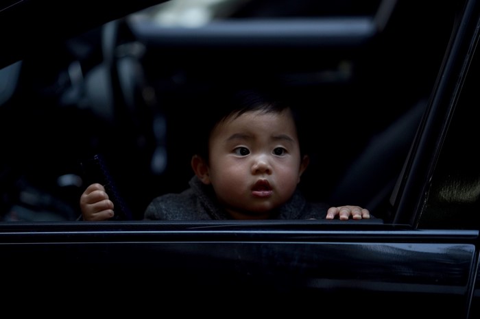 Baby looking out of a car window