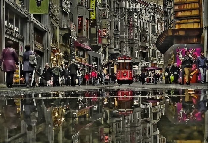 Red tram on a wet street in Istanbul