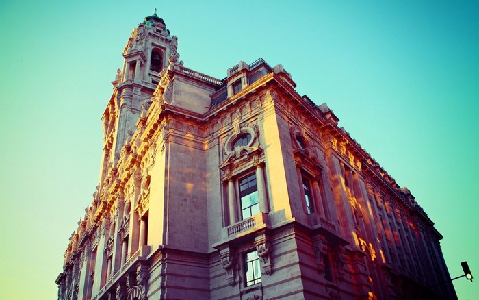 Old building with ornate facade and tower against sky