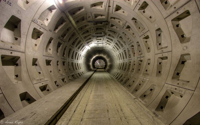 Concrete tunnel with train tracks