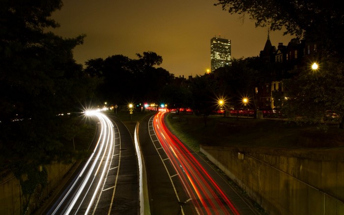 Long exposure of city highway at night with light trails