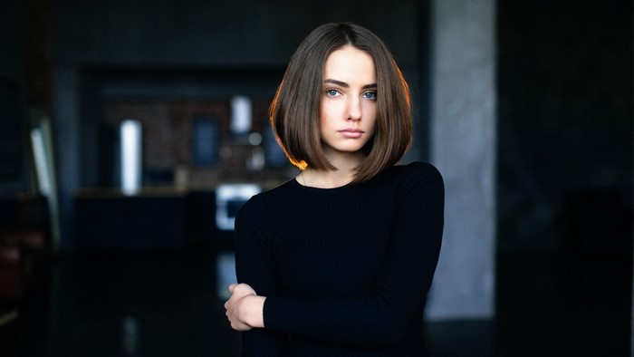 Woman with bob haircut in black top