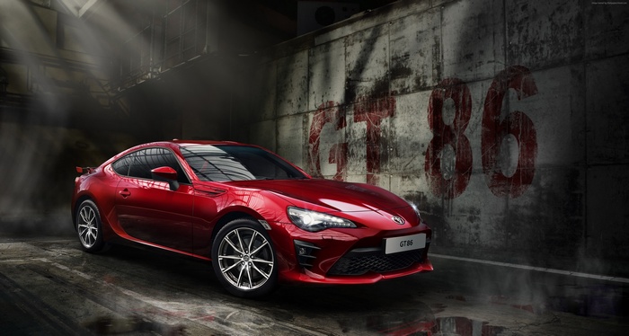 Red Toyota GT 86 coupe in a garage