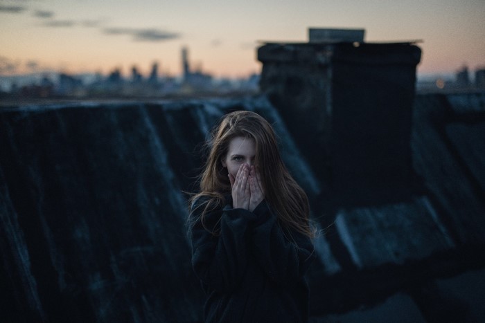 Woman on a rooftop at dusk