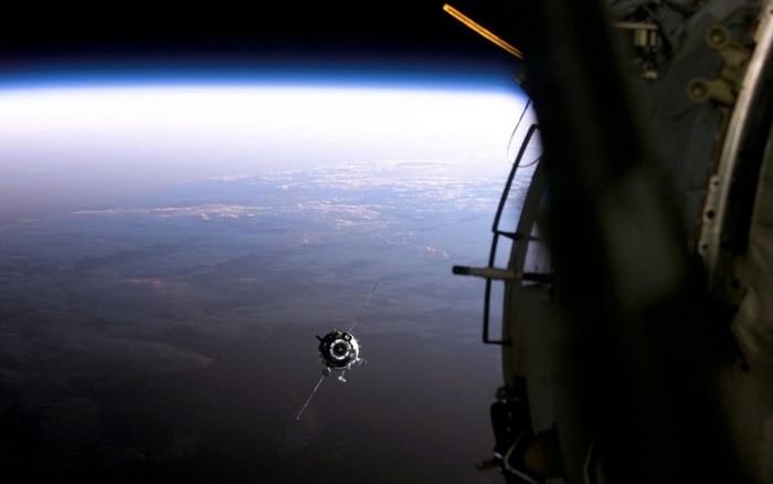 Soyuz spacecraft approaching Earth from space