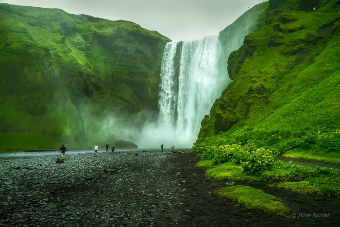 Skogafoss Waterfall in Iceland with Tourists