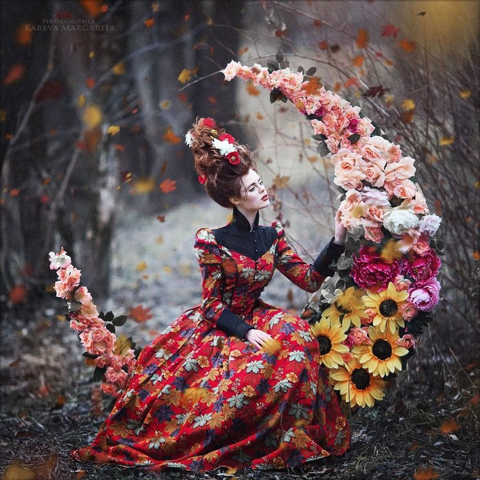 Woman in floral dress with flowers on crescent moon