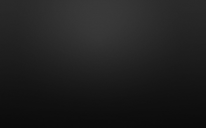 Black textured surface with diagonal lines