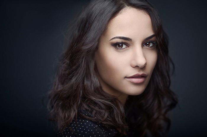 Portrait of a woman with dark wavy hair