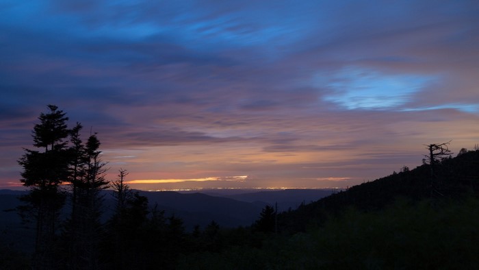 Mountain landscape at dusk with city lights