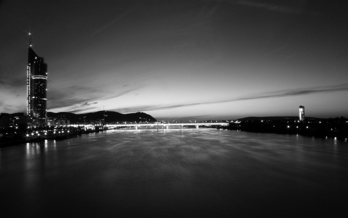 Night cityscape with river and bridge in Vienna