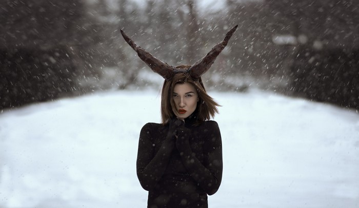 Woman with horns in the snow