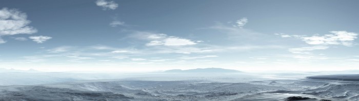 Panorama of a snowy Arctic landscape with mountains on the horizon