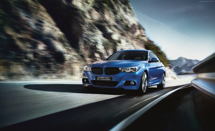 Blue BMW 3 Series Gran Turismo M Sport on a winding road