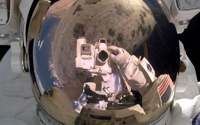 Astronaut taking a selfie with the Space Shuttle