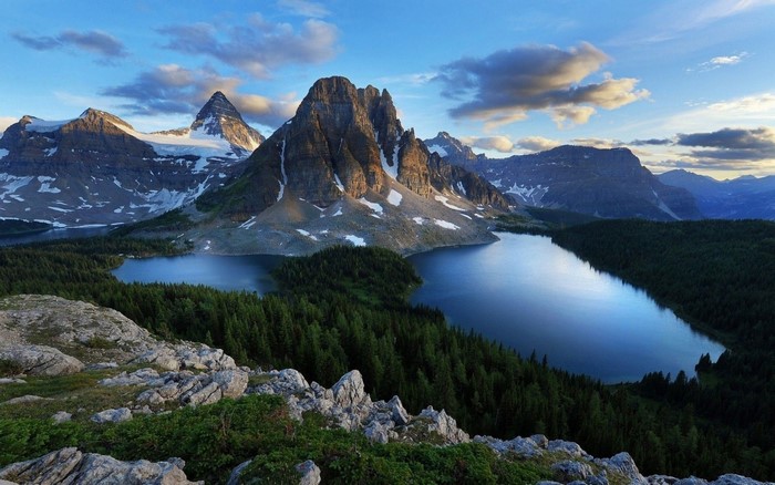 Mountain range with lakes and forest at sunset