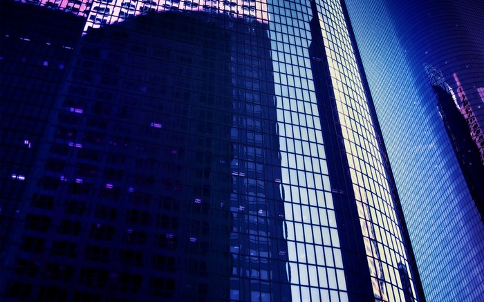 Modern skyscrapers with glass facades at night