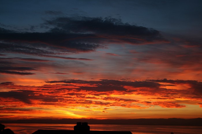 Sunset over the sea with dramatic clouds