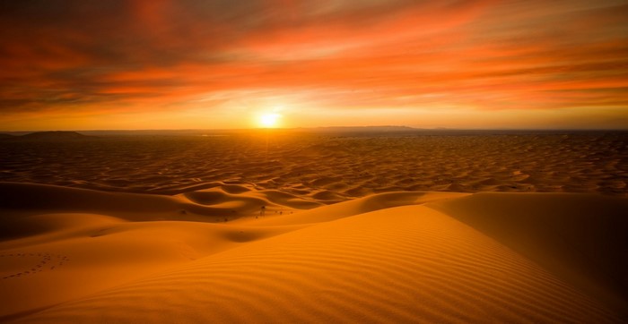 Sunset Over the Vast Sahara Desert Dunes