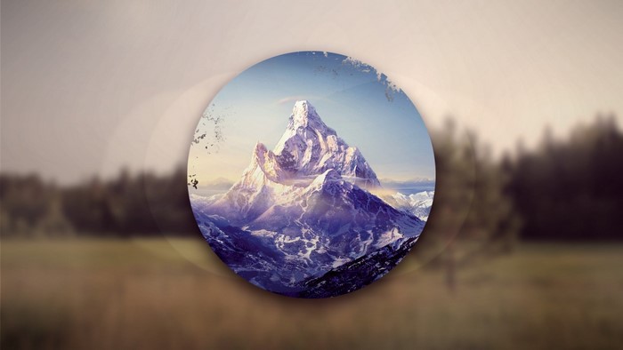 Snow-capped mountains in a circular frame