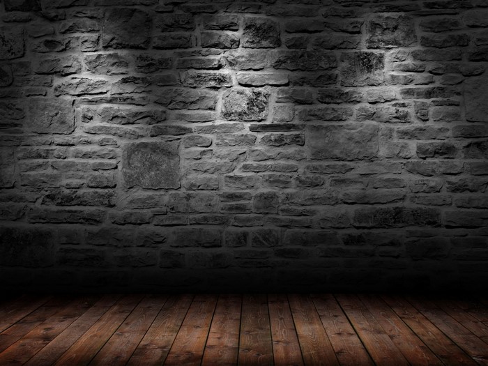 Stone wall and wooden floor with spotlights