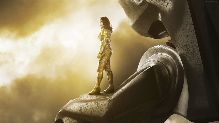 Yellow Ranger standing on a giant robot