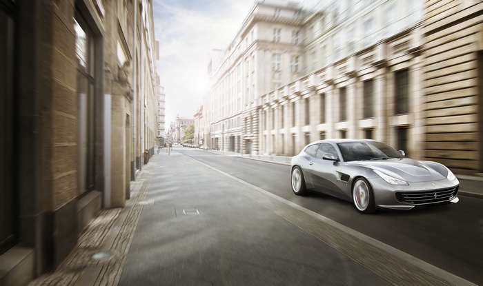 Silver Ferrari GTC4Lusso T driving on a city street