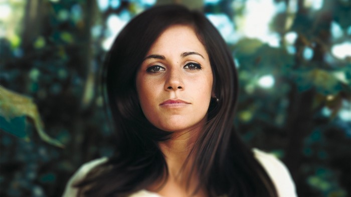 Woman with long dark hair in a close-up portrait