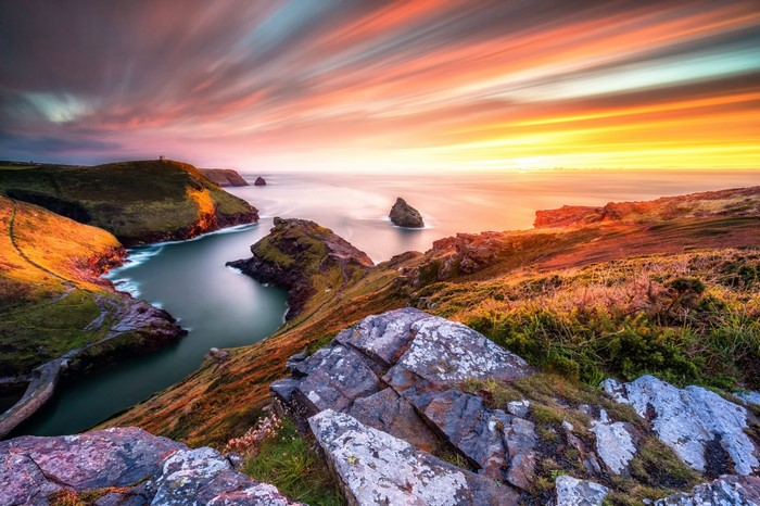 Coastal landscape at sunset with dramatic sky and sea