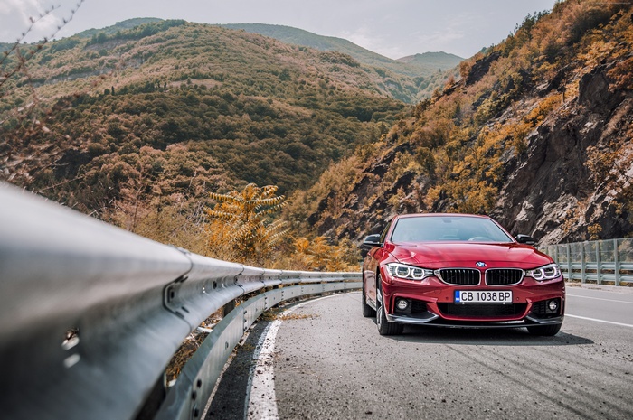 Red BMW 440i Coupe on a Mountain Road