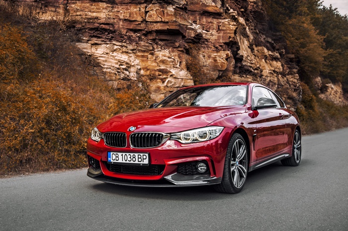 Red BMW 440i Coupe on a Road