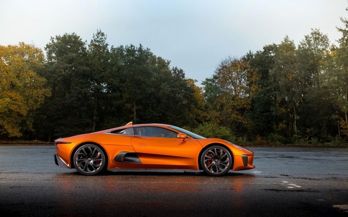 Orange Jaguar C-X75 sports car on wet asphalt