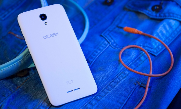 Alcatel Pop 4 smartphone on blue denim
