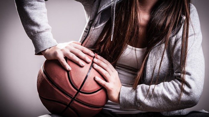 Woman holding a basketball
