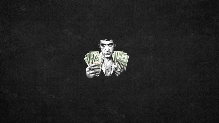 Tony Montana from Scarface holding money