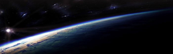 Earth from space with sun and stars