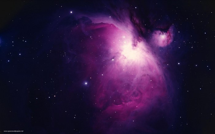 Purple and pink nebula in outer space with stars