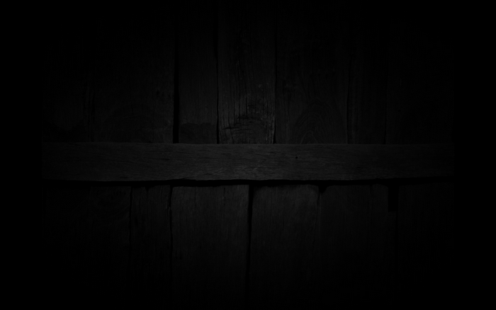 Dark wooden planks with a horizontal beam