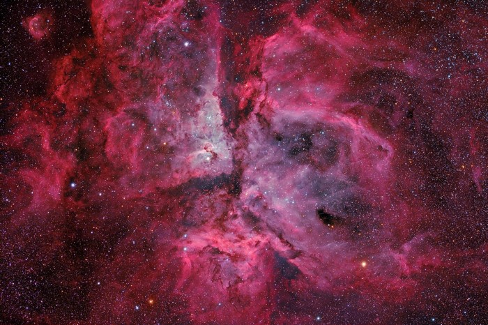 Carina Nebula in space with stars and gas clouds