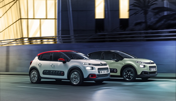 Citroen C3 cars on a road at night